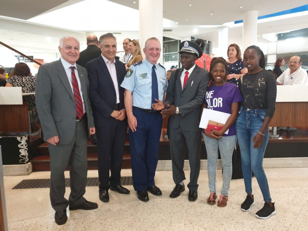 Morris of Kwetu Project  being recognised for Community Support by Australian Police Personnel.