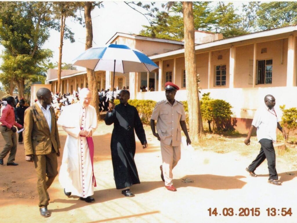 HE. + The Pope Nuncio Micheal B,  Fr Cloudius Ssegonja & Morris